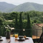 Breakfast on a wooden table with a natural view